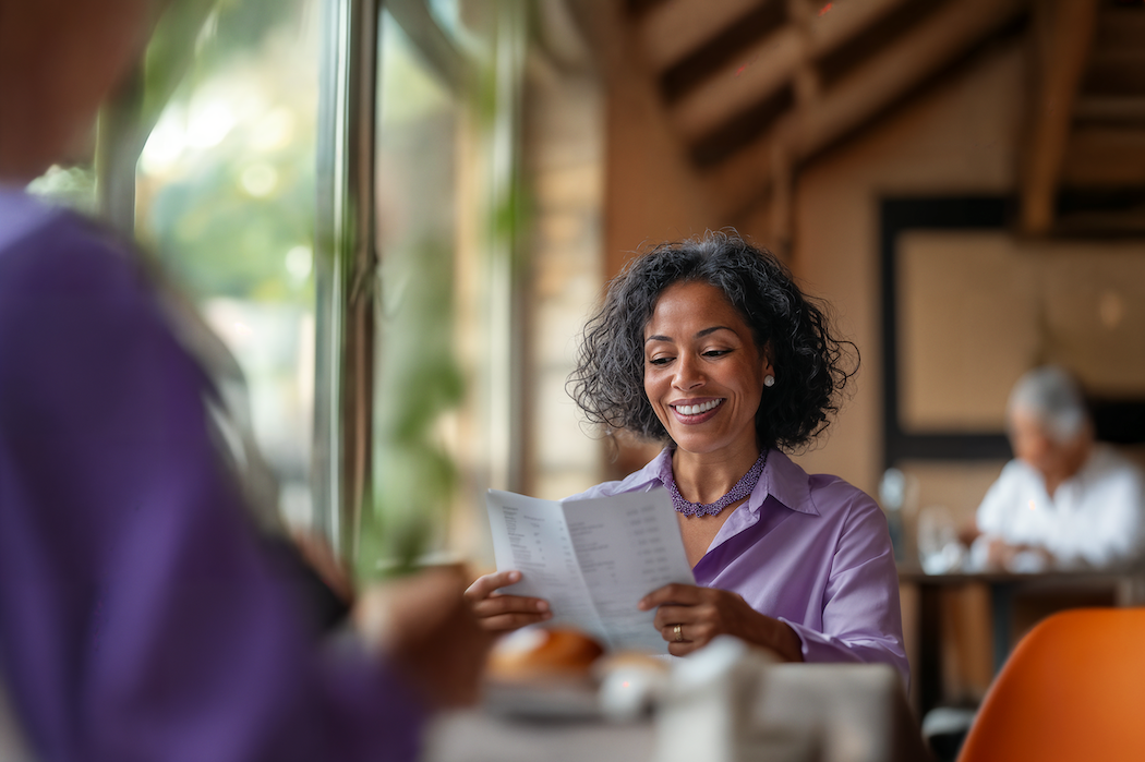 7. woman reading the menu in a restaurant